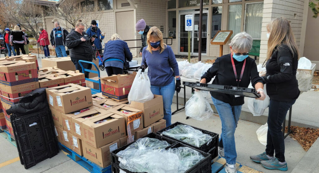 rha employees at a food bank event