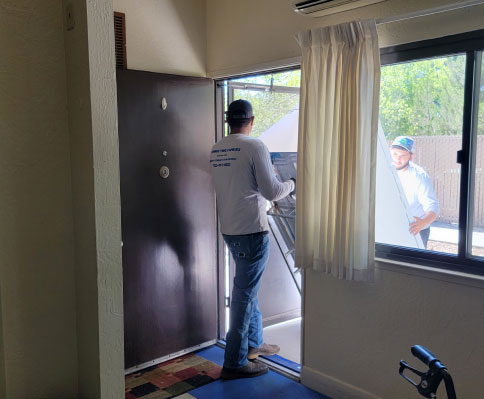 rha employees moving a fridge